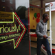 A man walks out of a payday loan store.